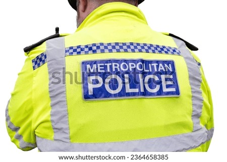 Back of the vest of a London Metropolitan Police Officer in Hi-visibility Uniform isolated on white background