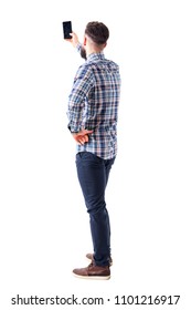 Back View Of Adult Man Taking Photo Or Selfie With Smartphone. Full Body Isolated On White Background.