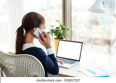 Back View Of African Business Lady Talking On Phone In Office