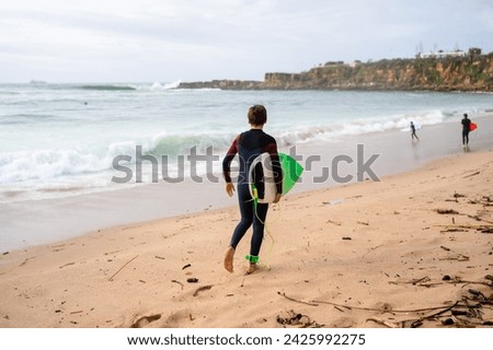 Similar – Image, Stock Photo Anonymous surfer with surfboard resting near sea