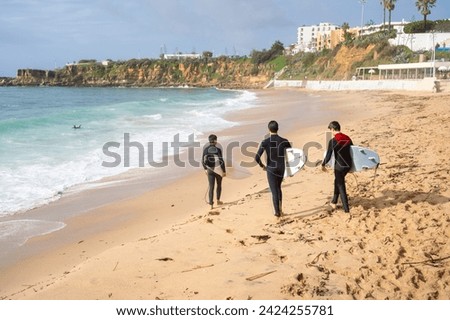 Similar – Image, Stock Photo Anonymous surfer with surfboard resting near sea