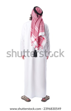 Back view of an Arab man in thobe standing on white isolated background