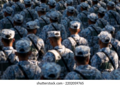 Back View Of Army In Formation. Blur Background With Bokeh.