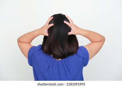 Back View Of Asian Woman Grabbing His Head Showing Stress Gesture