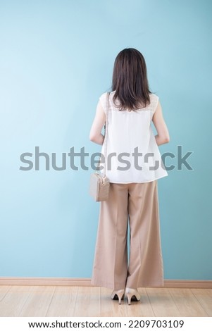 Back view of an Asian woman (whole body)