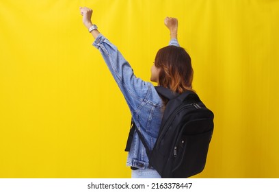 Back View Of Asian Young Woman Standing While Carrying School Bag. Successful Concept.