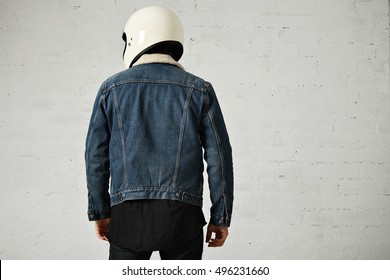 Back View Of Athletic Biker Wearing Club Denim Shearling Jacket And Helmet, Isolated On White