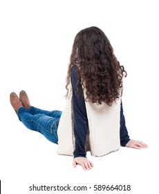 Back View Beautiful Curly Woman Sitting On Floor And Looks Into Distance. Girl Relaxes. Rear View People Collection. Backside View Of Person. Isolated Over White Background.