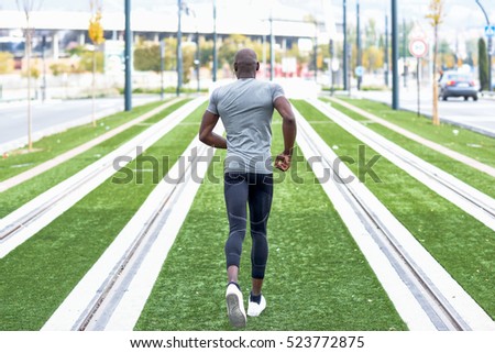 Similar – Black man practicing yoga in urban background.