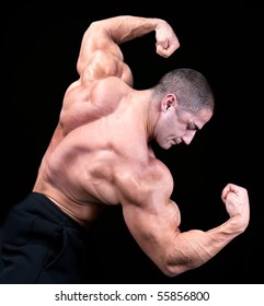Back View Of A Body Builder, Isolated On Black