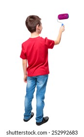 Back view of boy painting something with roller on white background