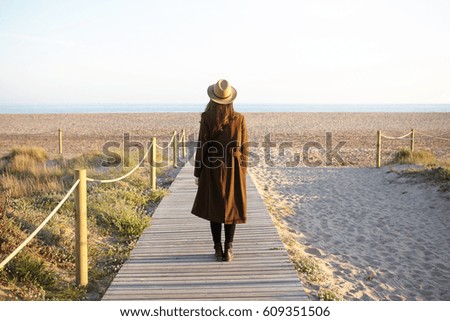 Unrecognizable traveler standing on volcano in Tenerife