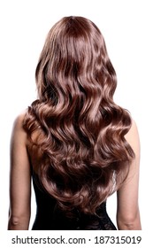 Back View Of Brunette Woman With Long Black Curly Hair Posing At Studio.