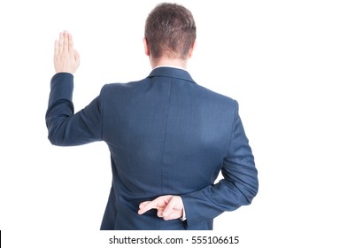 Back View Of Business Man Or Politician Standing Raising Hand Taking Oath And Holding Fingers Crossed Isolated On White Background