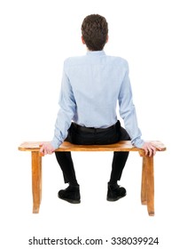 Back View Of Business Man Sitting On Chair.  Businessman Watching. Rear View People Collection.  Backside View Of Person.  Isolated Over White Background. Businessman Resting On A Wooden Bench