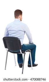 Back View Of Business Man Sitting On Chair.  Businessman Watching. Rear View People Collection.  Backside View Of Person.  Isolated Over White Background. Bearded Businessman In White Shirt Sits On A