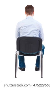 Back View Of Business Man Sitting On Chair. Bearded Businessman In White Shirt Sits On A Chair.