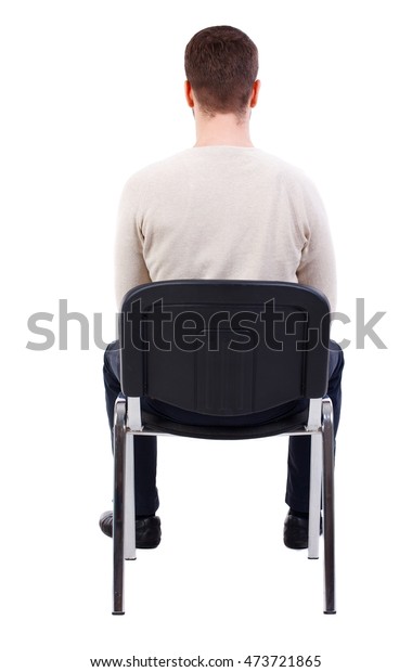 椅子に座っている実業家の後ろ姿 白い暖かいセーターを着た髭を生やした男が椅子に座る の写真素材 今すぐ編集