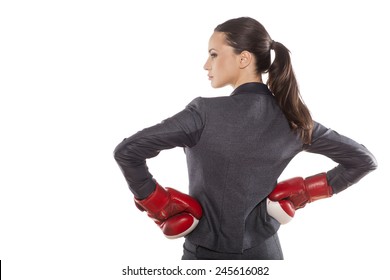 Back View Of Business Woman With Boxing Gloves On A White 