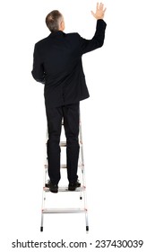 Back View Of Businessman Climbing Ladder.