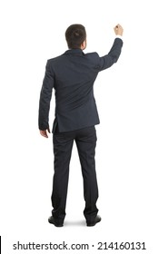 Back View Of Businessman In Formal Wear Writing On White Wall