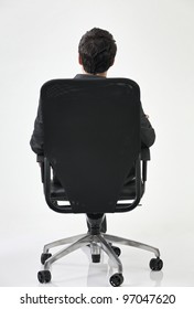 Back View Of Businessman Sitting At The Chair