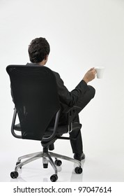 Back View Of The Businessman Sitting On The Chair