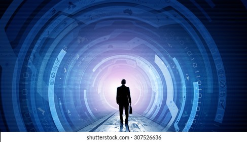 Back View Of Businessman With Suitcase In Hands Looking At Virtual Panel