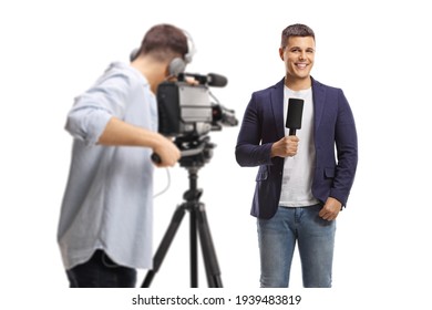 Back View Of A Cameraman Recording A Male Reporter Isolated On White Background