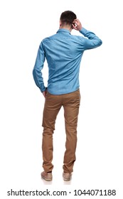 Back View Of A Casual Man Scratching His Head And Thinking On White Background