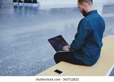 Back View Of Caucasian Man Keyboarding On Laptop Computer With Blank Copy Space Screen For Your Text Message Or Advertising Content, Male Freelancer Working On Net-book After Talking On Mobile Phone