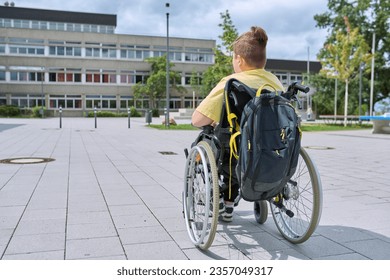 Back view, child preteen boy on wheelchair going to school building - Powered by Shutterstock