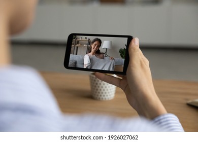 Back View Close Up Of Woman Hold Use Smartphone Watch Video Shopping Haul On Gadget Online. Female Have Webcam Digital Consultation With Stylist, Talk On Web Call On Cellphone. Virtual Event Concept.