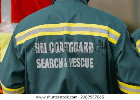 A back view of coastguard rescue officer wearing a uniform