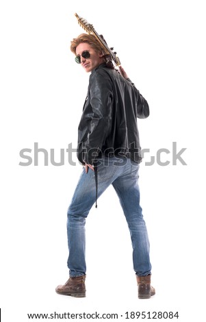 Back view of cool macho rock music guitarist turning at camera posing with guitar on shoulder. Full body isolated on white background. 
