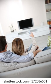 Back View Of Couple Watching Tv