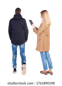 Back view of couple in winter jacket photographed on a mobile phone in winter jacket.  Rear view people collection. backside view of person. Isolated over white background.