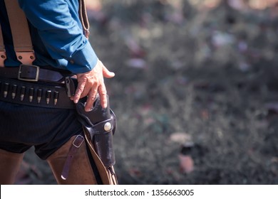 Back View Of Cowboy With Gun Prepares To Gun Fight.cowboy With Gun.