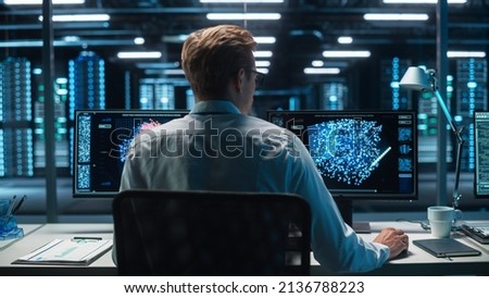 Back View of the Data Analysts Work on Visualisation with Machine Learning on Two Computer Screens in Modern Office. Data Science in Business, Finance and Innovation. Photo stock © 