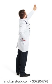 Back View Of Doctor In White Smock Raising His Hand Up And Showing Stop Sign. Isolated On White Background