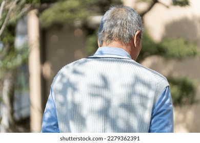 Back view of elderly man