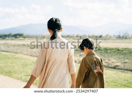 Back view of elementary school students walking down the street