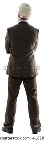 Back view of engineer in helmet isolated on white background