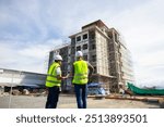 back view Engineering people, construction site. construction worker planning and architecture in construction site. Caucasian men