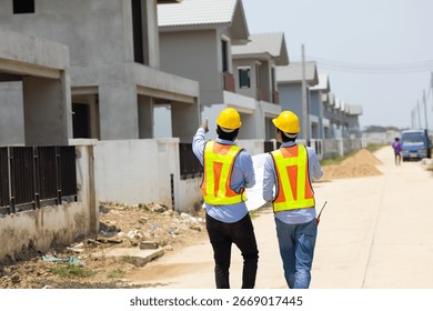back view Engineering people, construction site. construction worker planning and architecture in construction site. Caucasian men