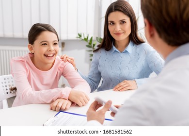 Back View Of Ent Physician Near Smiling Daughter And Mother