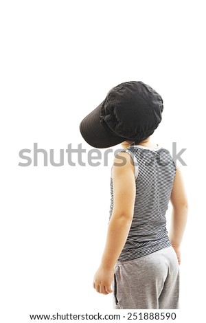 Back view of fashionable little boy.Hip-Hop Style  looking at wall. Pose Boy in Tracker Hat. Young Rapper. Funny Child in Cap. 5 years old. Rear view. Isolated on white background  