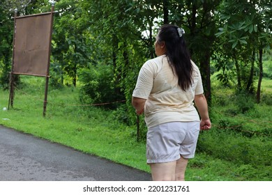 Back View Fat Woman Jogging In The Park