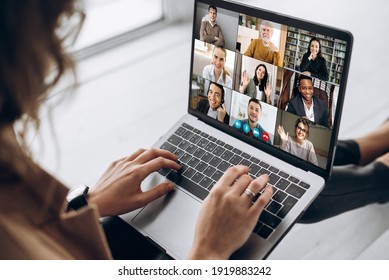 Back View Of Female Employee Communicate On Video Call With Multiracial Colleagues, Woman Worker Conducts Webcam Group Conference With Business Partners Uses Laptop And App