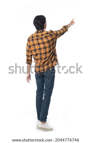 Back view Full body portrait of young man with jeans with finger to side in studio isolated on white background

